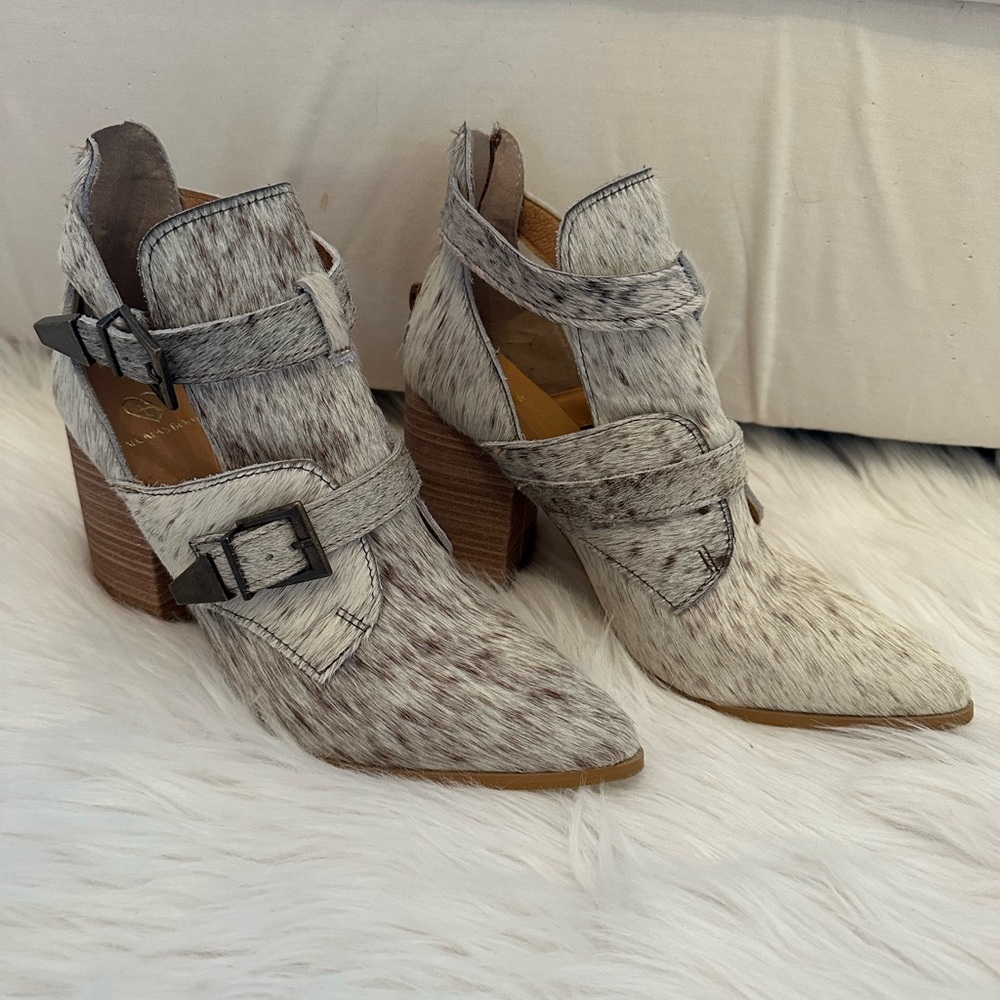 Alcala’s Hair on Hide Cowhide buckle ankle boots